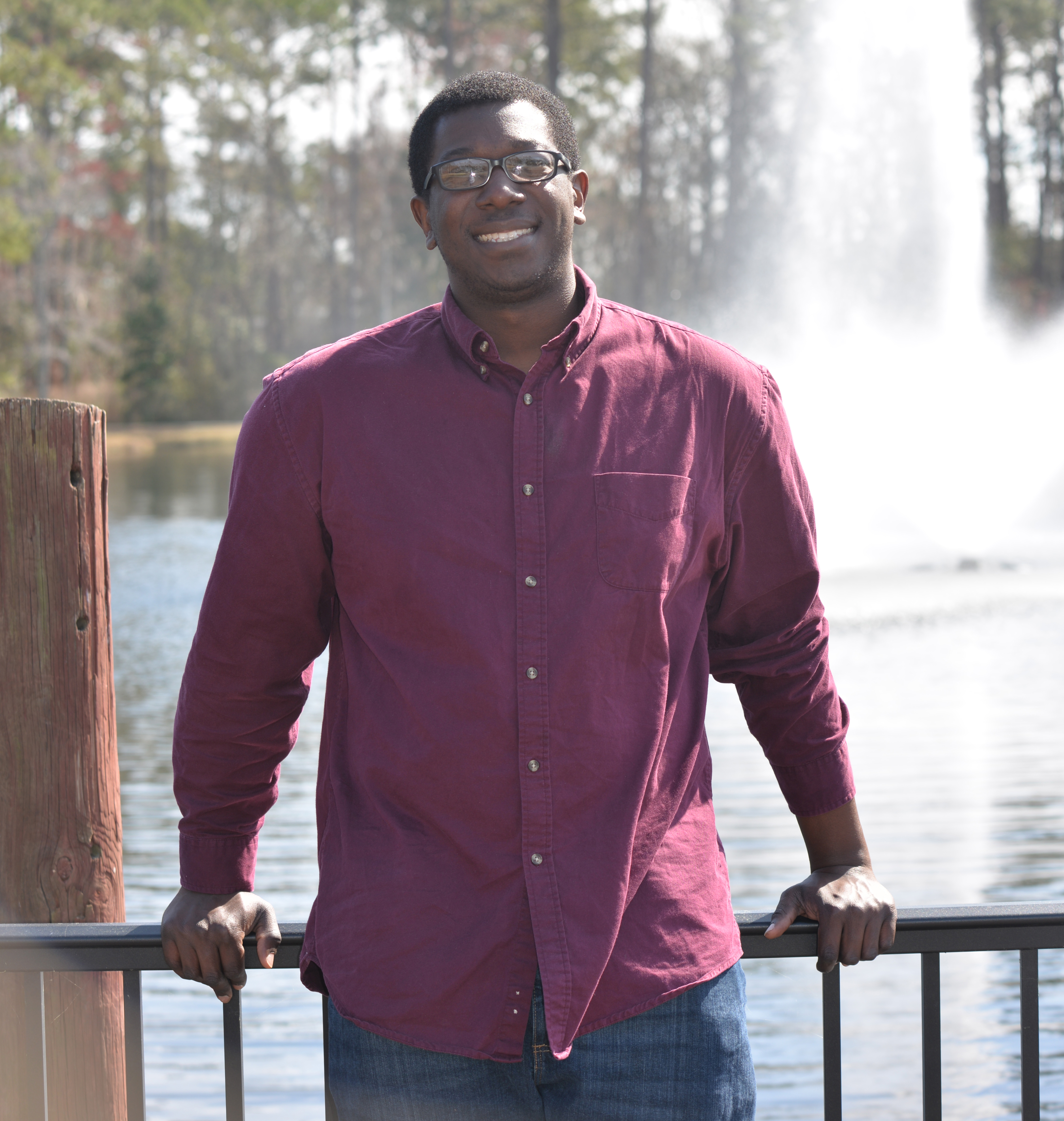 College of Coastal Georgia student Eric Seals stands by one of his favorite spots on campus, Lake Teel.