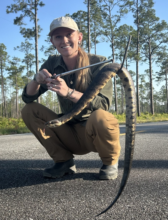 Coastal Georgia alumna Abbey Crossman with snake